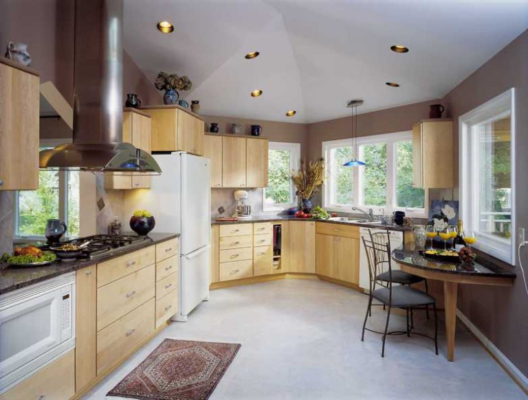 ADDITION ENLARGES KITCHEN, OPENS TO VIEW.