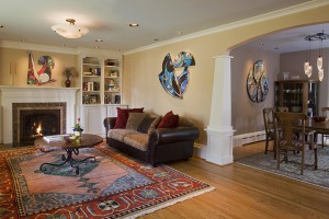 REMOVING WALLS BETWEEN KITCHEN, DINING ROOM AND SUNROOM OPENS LIVING SPACE.